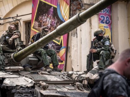 Members of Wagner group sit atop of a tank in a street in the city of Rostov-on-Don, on June 24, 2023. President Vladimir Putin on June 24, 2023 said an armed mutiny by Wagner mercenaries was a "stab in the back" and that the group's chief Yevgeny Prigozhin had betrayed …