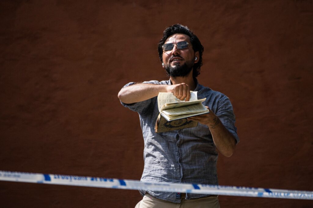 Salwan Momika protests outside a mosque in Stockholm on June 28, 2023, during the Eid al-Adha holiday. Momika, 37, who fled from Iraq to Sweden several years ago, was granted permission by the Swedish police to burn the Muslim holy book during the demonstration. (Photo by Jonathan NACKSTRAND / AFP) (Photo by JONATHAN NACKSTRAND/AFP via Getty Images)