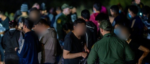 Border Patrol agents apprehended a large group of mostly Chinese migrants. (Brandon Bell/Getty Images)