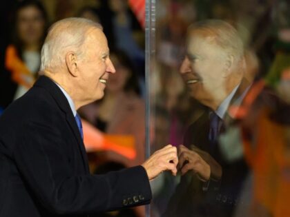 US President Joe Biden peers around a protective bullet=proof screen during a celebration event at St Muredach's Cathedral on April 14, 2023 in Ballina, Ireland. US President Joe Biden has travelled to Northern Ireland and Ireland with his sister Valerie Biden Owens and son Hunter Biden to explore his family's …