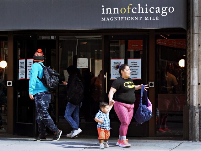 CHICAGO, ILLINOIS - MAY 10: People walk by at the Inn of Chicago, a hotel near the Magnifi