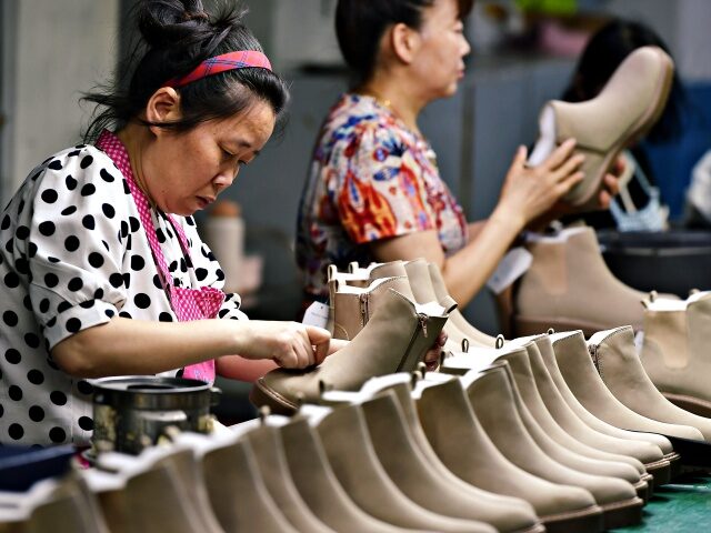 FUZHOU, CHINA - JUNE 07: Employees make leather shoes for export at a factory on June 7, 2