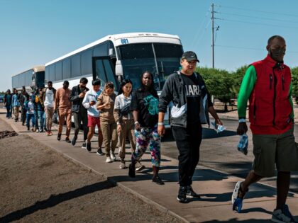YUMA, ARIZONA - JUNE 06: Migrants board a bus for physical examination at the U.S.-Mexico border on June 6, 2023 in Yuma, Arizona. Fewer migrants arrived at the border after Title 42 expired. (Photo by Qian Weizhong/VCG via Getty Images)