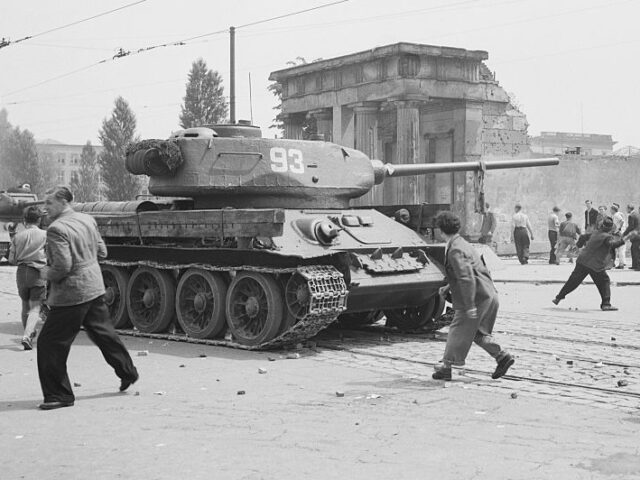 (Original Caption) 6/10/1973- Berlin, Germany: Men against tanks. A Russian tank is attack