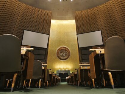 NEW YORK - MAY 12: The United Nations logo on the back wall of the General Assembly Hall o