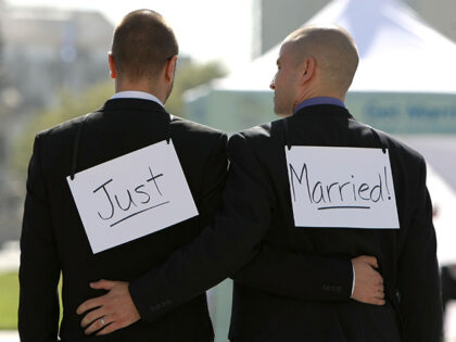 Same-sex couple Ariel Owens (R) and his spouse Joseph Barham walk arm in arm after they were married at San Francisco City Hall June 17, 2008 in San Francisco, California. Same-sex couples throughout California are rushing to get married as counties begin issuing marriage license after a State Supreme Court …