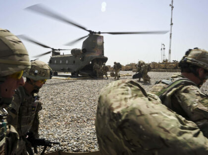 Previously unreleased photo dated 23/03/12 of troops from C Company 1st Battalion the Princess of WalesâÄôs Royal Regiment (1 PWRR) in Afghanistan on Operation Herrick 15, as part of Task Force Helmand, as they board a Chinook helicopter at Patrol Base (PB) Clifton, which will ferry them back home as …