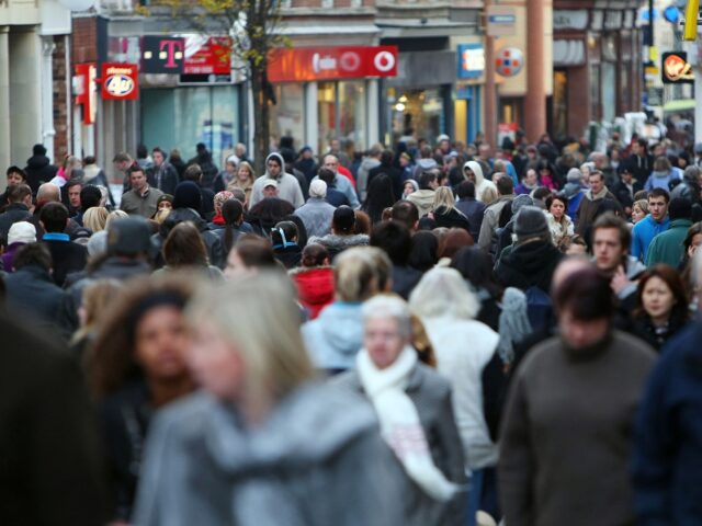 NOTTINGHAM, ENGLAND - DECEMBER 18: Christmas shoppers pack the streets of Nottingham as many people across the UK finish work for the seasonal holiday on December 18, 2009 in Nottingham, England. The last weekend before Christmas is expected to be the busiest of the year as many high street retailers …