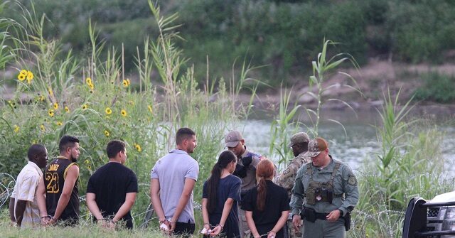 NextImg:Migrants Charged by Texas Police for Breaching Border Barriers