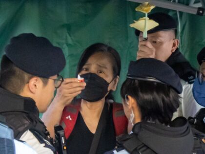 Chan Po Ting, an activist from the League of Social Democrats, is detained by police officers near Victoria Park, the traditional site of the annual Tiananmen candlelight vigil, in Hong Kong, China, on Sunday, June 4, 2023. For almost three decades, people in Hong Kong commemorated the June 4 anniversary …