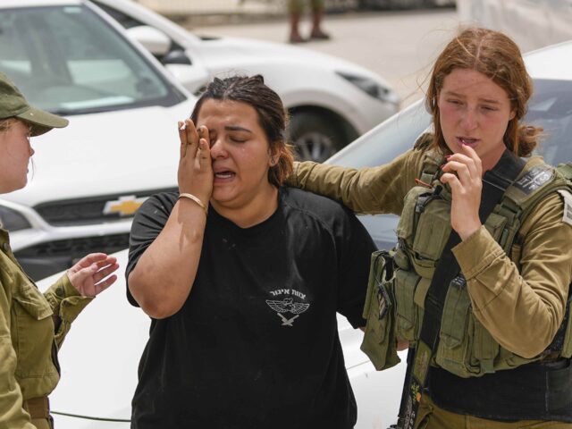 Israeli soldiers cry (Tsafrir Abayov / Associated Press)