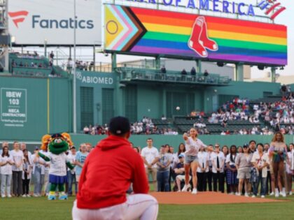 Boston, MA - June 13: Peloton instructor Jess King throws out the first pitch before the game on Pride Night. The Red Sox lost to the Colorado Rockies, 7-6, in 10 innings. (Photo by Jim Davis/The Boston Globe via Getty Images)
