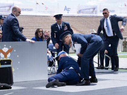 TOPSHOT - President Joe Biden is helped up after falling during the graduation ceremony at the United States Air Force Academy, just north of Colorado Springs in El Paso County, Colorado, on June 1, 2023. (BRENDAN SMIALOWSKI/AFP via Getty Images)