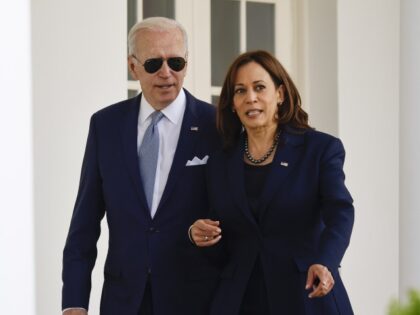U.S. President Joe Biden and Vice President Kamala Harris walk through the Colonnade of the White House in Washington, D.C., U.S., on Monday, April 11, 2022. Biden announced the finalization of new federal rules restricting so-called "ghost guns," which allow purchasers to assemble potentially untraceable weapons from kits. Photographer: Ting …