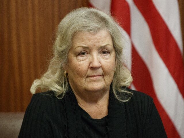 Juanita Broaddrick listens during a meeting with Republican presidential candidate Donald