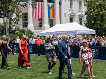 President Joe Biden, first lady Jill Biden and Betty Who, left in red, arrive for a Pride