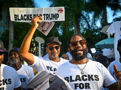 MIAMI, FLORIDA - JUNE 13: A Trump supporters gather outside the Wilkie D. Ferguson Jr. Uni