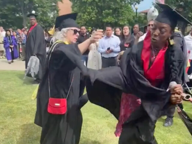 Kadia Iman grabbed the microphone from an educator's hand at her graduation as the older w