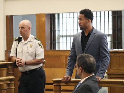New England Patriots cornerback Jack Jones, rear right, is shown at his arraignment on gun