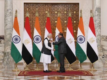 A handout picture released by the Egyptian Presidency on June 25, 2023 shows Egyptian president Abdel Fattah al-Sisi (R) granting the Order of the Nile medal to the Indian Prime Minister Narendra Modi in the capital Cairo. (Photo by AFP) (Photo by -/AFP via Getty Images)