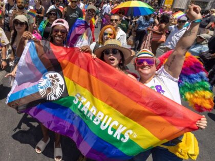 LOS ANGELES, CA - JUNE 12: Marchers with Starbucks pass through the landmark intersection