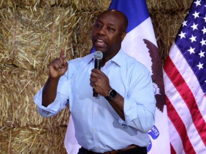 DES MOINES, IOWA - JUNE 03: Republican presidential candidate Senator Tim Scott (R-SC) speaks to guest during the Joni Ernst's Roast and Ride event on June 03, 2023 in Des Moines, Iowa. The annual event helps to raise money for veteran charities and highlight Republican candidates and platforms. (Photo by …