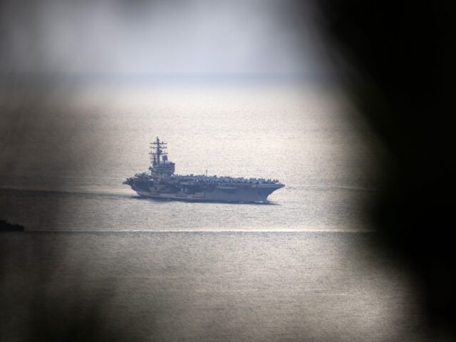 The USS Ronald Reagan, a Nimitz-class aircraft carrier and part of the US Navy 7th Fleet, approaches the naval base in Busan, South Korea, on Friday, Sept. 23, 2022. South Korean President Yoon Suk Yeol has pursued greater military cooperation with the US and rolled out security policies backing a tough line on …