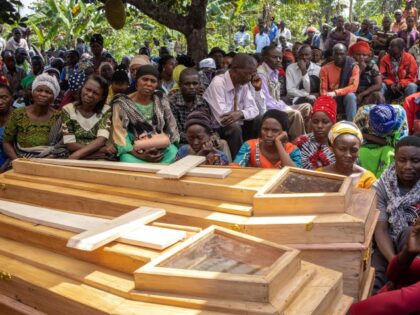 Uganda: Mourners gather for the funeral of Florence Masika and Zakayo Masereka during their burial rituals in Mpondwe on June 18, 2023. Florence and Zakayo have been killed near the border with the Democratic Republic of Congo by fleeing assailants whom the authorities believe to belong to the Allied Democratic …