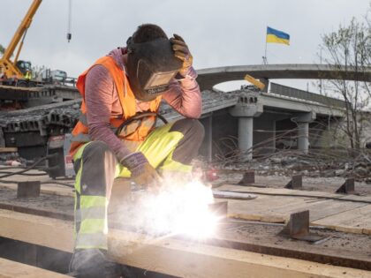 STOYANKA, UKRAINE - MAY 07: A worker is seen on the construction site of the new bridge, on May 7, 2022 in Stoyanka, Ukraine. Following Russia's retreat from areas around the Ukrainian capital, signs of normal life have returned to Kyiv, with residents taking advantage of shortened curfew hours, businesses …