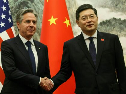 US Secretary of State Antony Blinken (L) and China's Foreign Minister Qin Gang shake hands