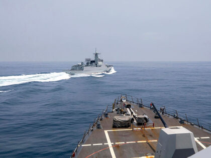 In this photo provided by the U.S. Navy, the USS Chung-Hoon observes a Chinese navy ship c