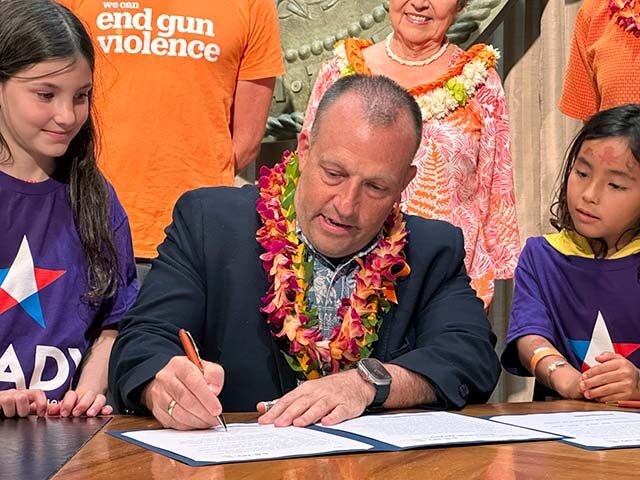 Hawaii Gov. Josh Green signs gun control legislation in Honolulu on Friday, June 2, 2023 a