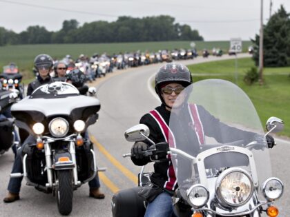Senator Joni Ernst, a Republican from Iowa, right, leads a group of motorcyclists during the 2nd annual Roast and Ride in Des Moines, Iowa, U.S., on Saturday, Aug. 27, 2016. Ernst, who in 2014 won the Senate seat vacated by Democrat Tom Harkin when he retired, has turned her Roast …
