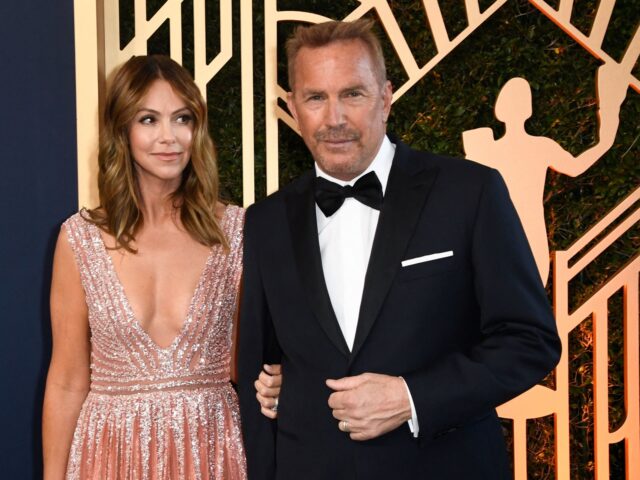 US actor Kevin Costner and his wife Christine Baumgartner arrive for the 28th Annual Screen Actors Guild (SAG) Awards at the Barker Hangar in Santa Monica, California, on February 27, 2022. (Photo by Patrick T. FALLON / AFP) (Photo by PATRICK T. FALLON/AFP via Getty Images)