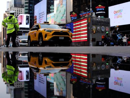 A traffic officer directs cars near Times Square in New York City on June 16, 2023. (Photo by Leonardo Munoz / AFP) (Photo by LEONARDO MUNOZ/AFP via Getty Images)