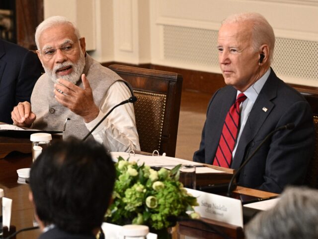 US President Joe Biden looks on as India's Prime Minister Narendra Modi speaks during a me