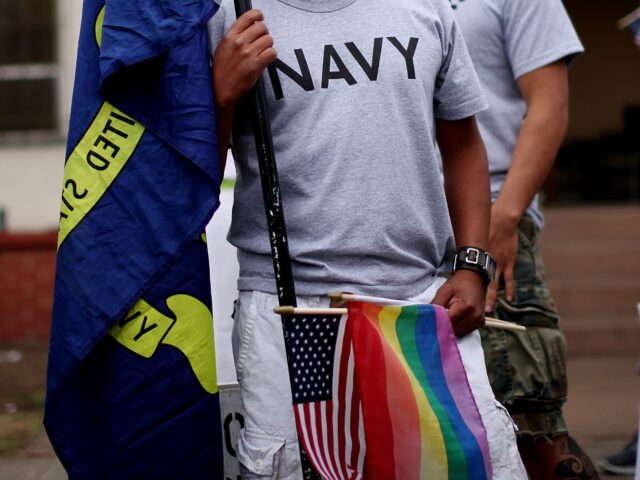 SAN DIEGO, CA JULY 16: Joseph Martinez,M, an active duty sailor in the Navy, prepares to march during the San Diego Gay Pride Parade on Saturday, July 16, 2011 in San Diego, California . Hundreds of active duty military personel -gay and straight, participated for the first time in the …