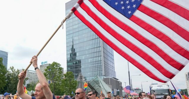 Ambassador to Poland Waves U.S. Flag and Joins Warsaw Pride Parade