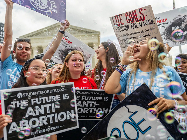 WASHINGTON, DC - JUNE 24: Anti-abortion activists celebrate in response to the Dobbs v Jackson Women's Health Organization ruling in front of the U.S. Supreme Court on June 24, 2022 in Washington, DC. The Court's decision in Dobbs v Jackson Women's Health overturns the landmark 50-year-old Roe v Wade case and erases a federal right to an abortion. (Photo by Brandon Bell/Getty Images)