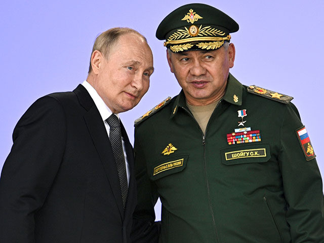 Russia's President Vladimir Putin and Russian Defense Minister Sergei Shoigu attend t