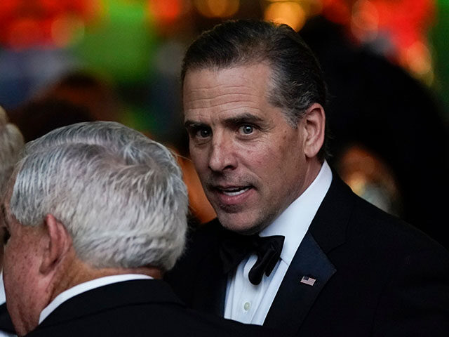 Hunter Biden talks with guests during a State Dinner for India's Prime Minister Naren