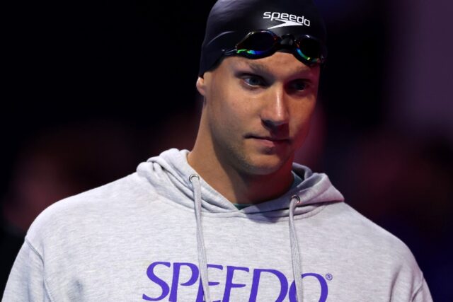 Caeleb Dressel walks to the starting blocks before the men's 50m butterfly final at the US