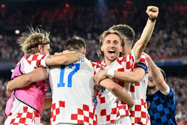 Croatia midfielder Luka Modric (C) celebrates with teammates after winning the Nations Lea