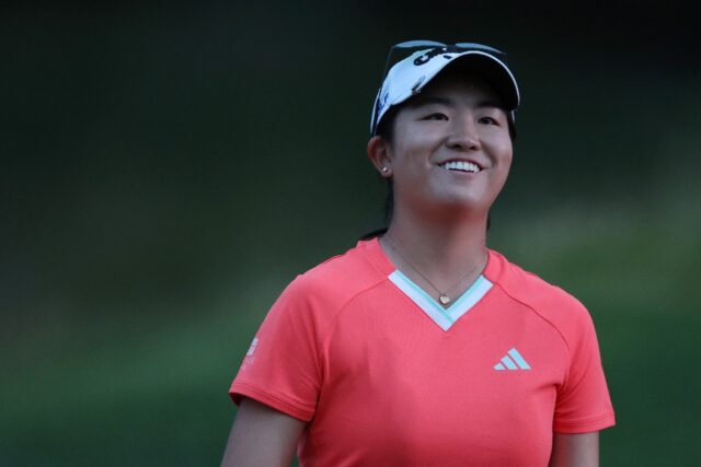 Dynamic debut: Rose Zhang of the United States smiles as she walks off the ninth green on