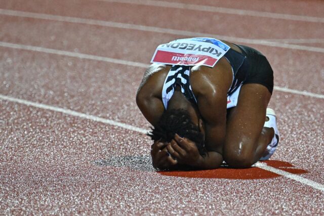 Faith Kipyegon reacts with joy and disbelief after breaking the women's 400m world record