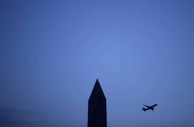 A flies behind the Washington Monument on the US National Mall in December 2016