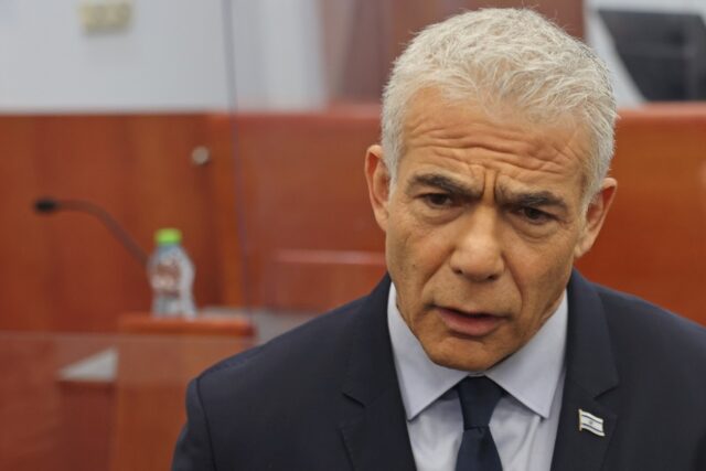 Former Israeli premier and opposition leader Yair Lapid arrived at court to testify