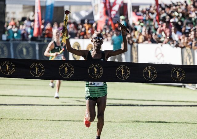 South African Tete Dijana wins the Comrades ultramarathon men's race with second-placed Pi