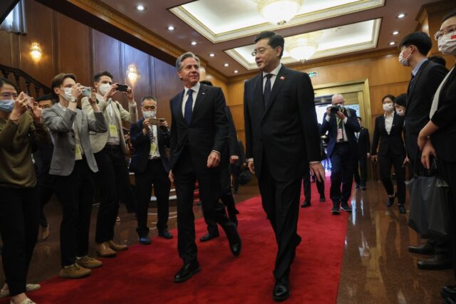 US Secretary of State Antony Blinken (L) walks with China's Foreign Minister Qin Gang (R) ahead of a meeting at the Diaoyutai State Guesthouse in Beijing on June 18, 2023.