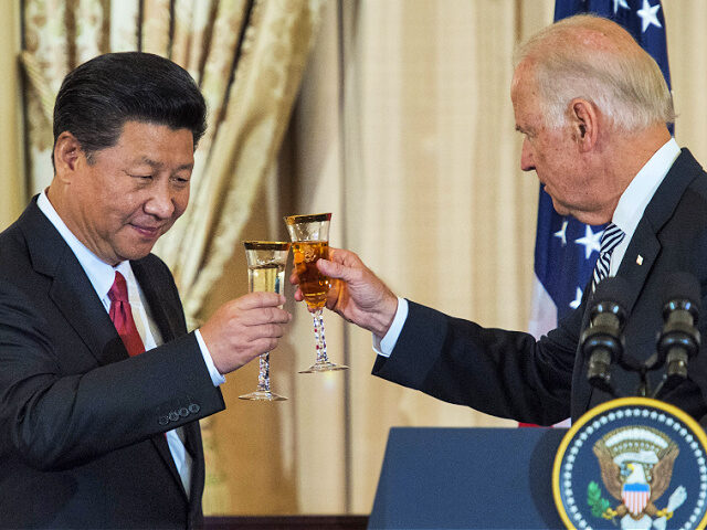 US Vice President Joe Biden and Chinese President Xi Jinping toast during a State Luncheon for China hosted by US Secretary of State John Kerry on September 25, 2015 at the Department of State in Washington, DC. AFP PHOTO/PAUL J. RICHARDS (Photo credit should read PAUL J. RICHARDS/AFP via Getty …